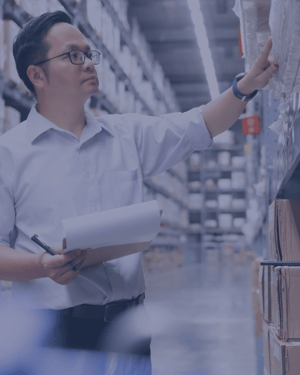 Man inspecting warehouse items