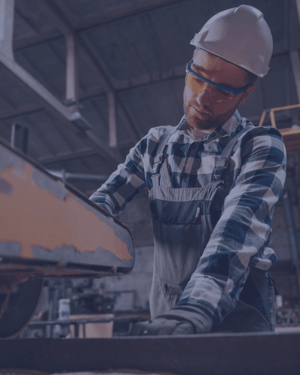 Worker at warehouse using machinery