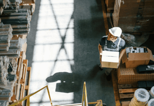 Worker in factory setting up equipment