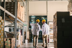 Inspectors walking in warehouse